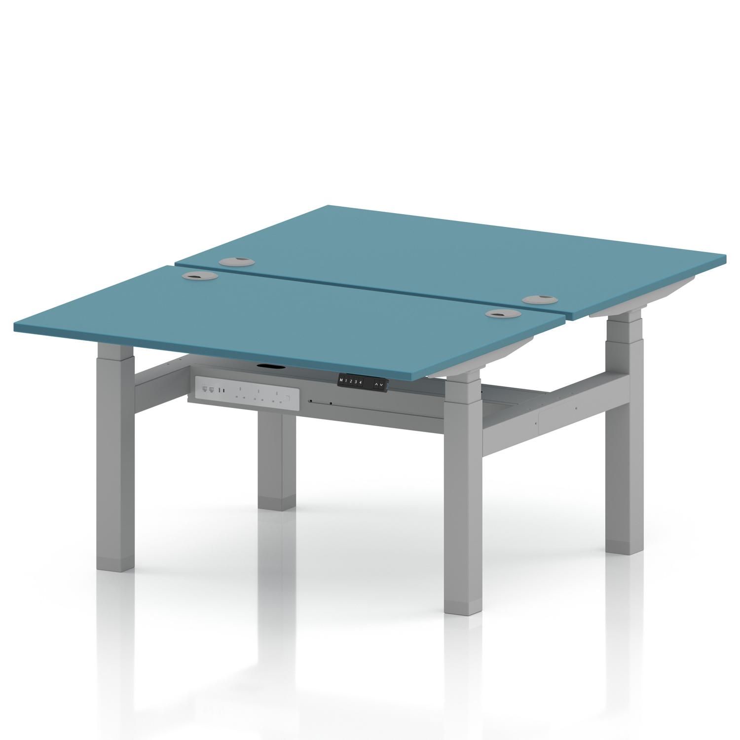 Air Back-to-Back 1200 x 800mm Height Adjustable 2 Person Office Bench Desk Dark Teal Top with Cable Ports Silver Frame Air Back-to-Back 1200 x 800mm Height Adjustable 2 Person Office Bench Desk Dark Teal Top with Cable Ports Silver Frame