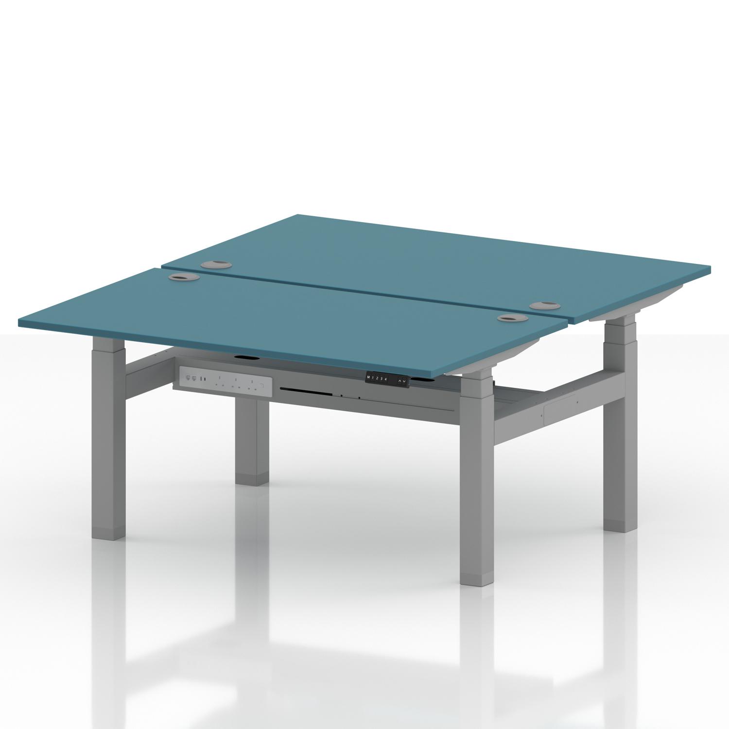 Air Back-to-Back 1400 x 800mm Height Adjustable 2 Person Office Bench Desk Dark Teal Top with Cable Ports Silver Frame Air Back-to-Back 1400 x 800mm Height Adjustable 2 Person Office Bench Desk Dark Teal Top with Cable Ports Silver Frame